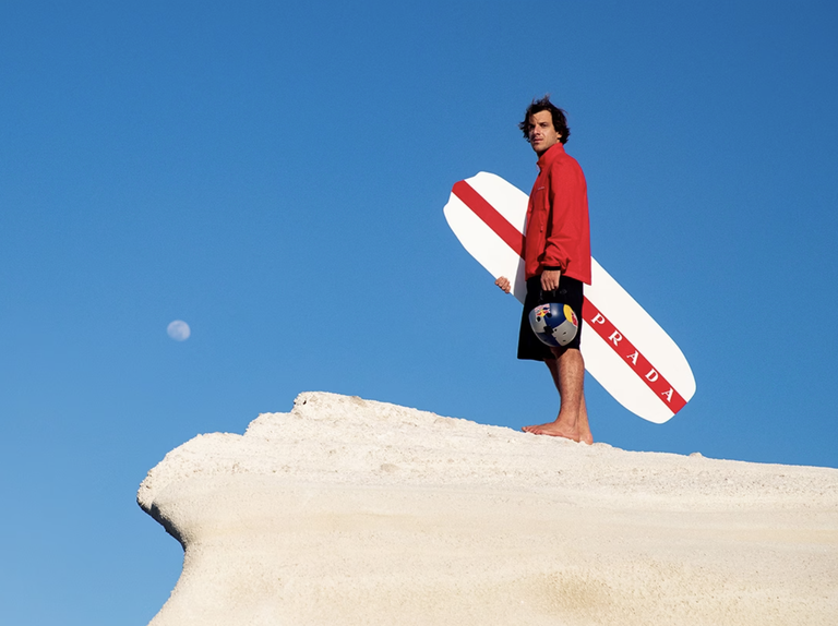 a man holding a surfboard