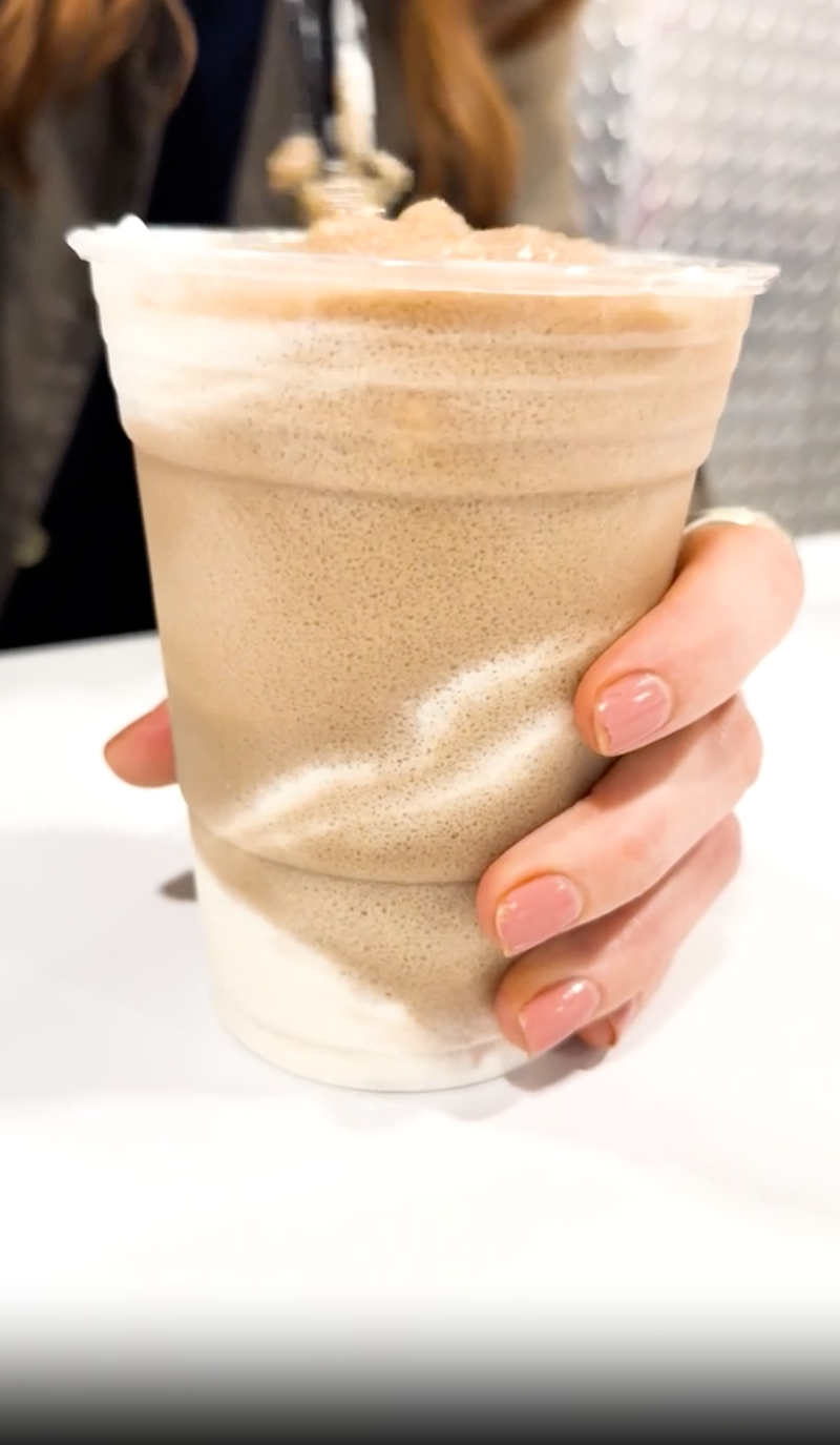 a person holding a cup