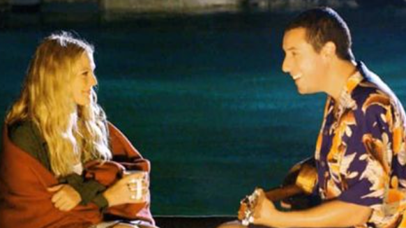'50 First Dates' Almost Had a Different Title a couple sitting on a bench by a body of water