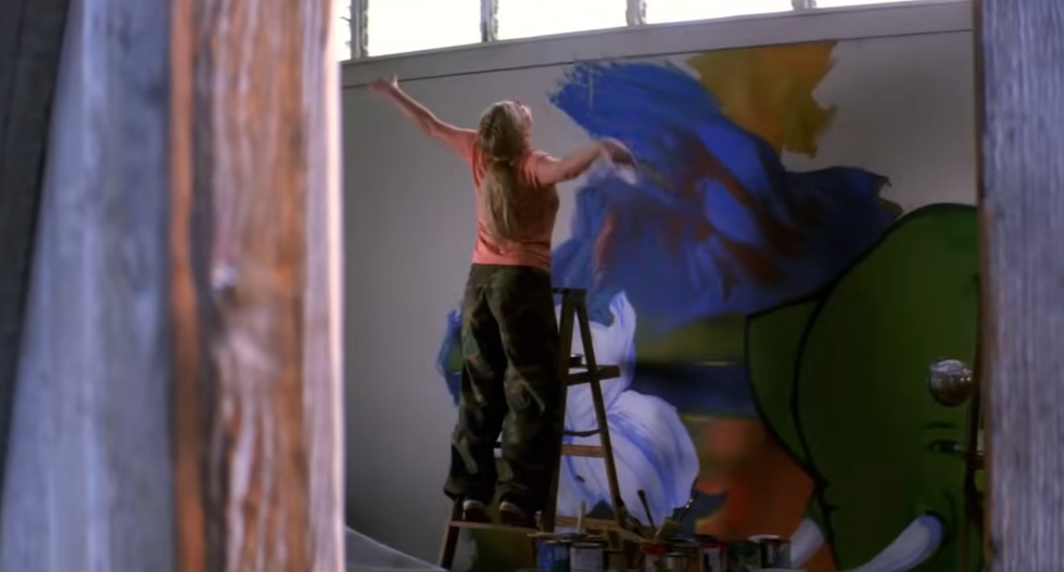 a person painting a picture