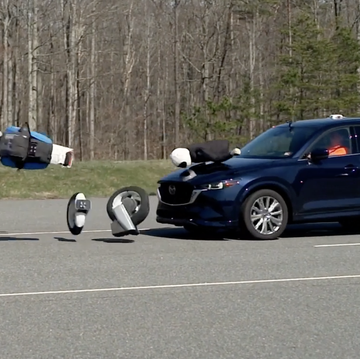 mazda crossover hits motorcycle crash test dummy in test