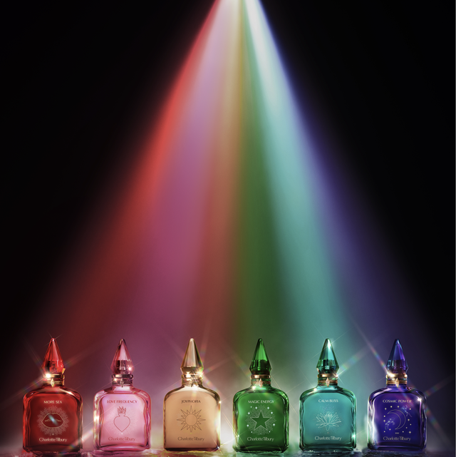 a group of glass jars with a rainbow in the background