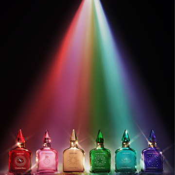 a group of glass jars with a rainbow in the background a group of glass jars with a rainbow in the background