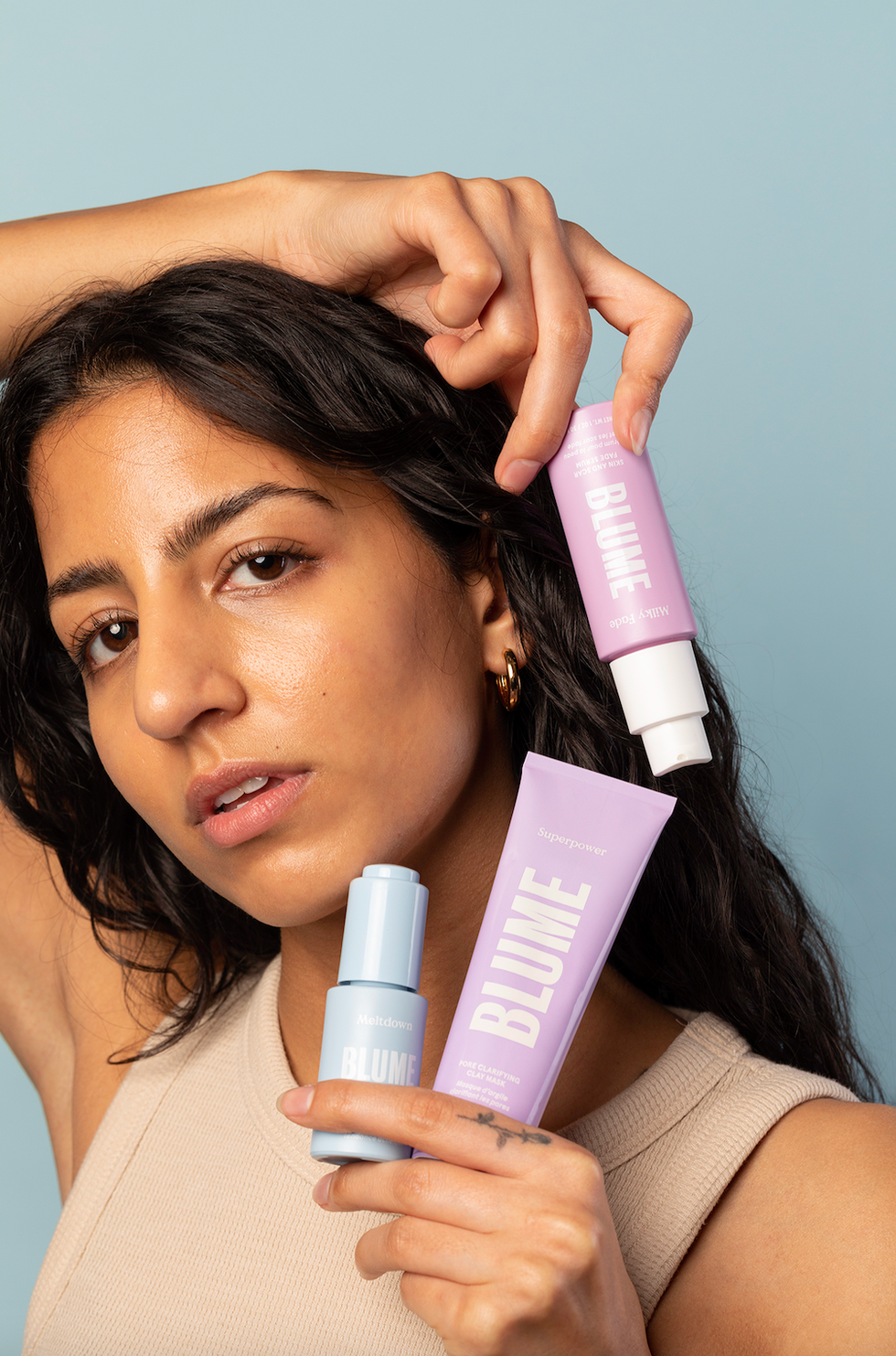 blume products in a women's hand