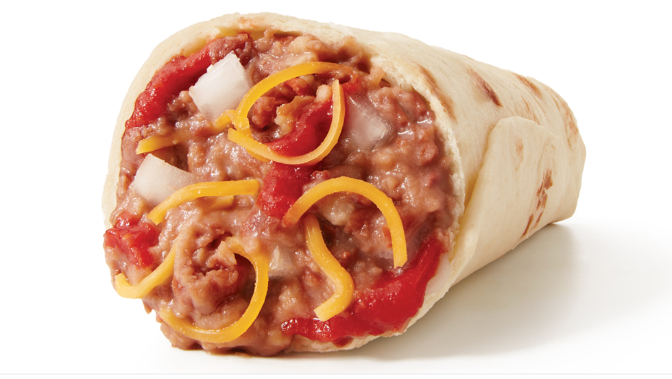 a loaf of bread with cheese and sauce on it