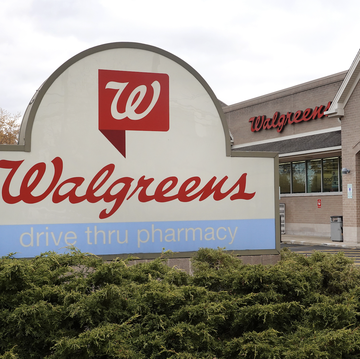 a sign sits in front of a walgreens store on november 10, 2023 in wheeling, illinois walgreens boots alliance, the parent company of walgreens, plans to lay off 267 corporate employees, roughly 5 of it corporate workforce, as it implements a $1 billion cost reduction initiative announced in october