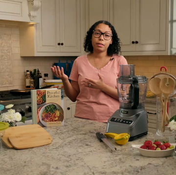 a woman in a kitchen a woman in a kitchen
