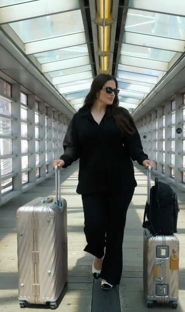 ashley graham tumi airport outfit