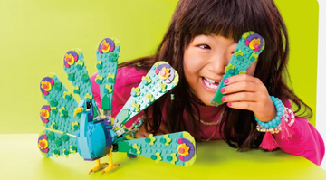 girl playing with turkey lego set