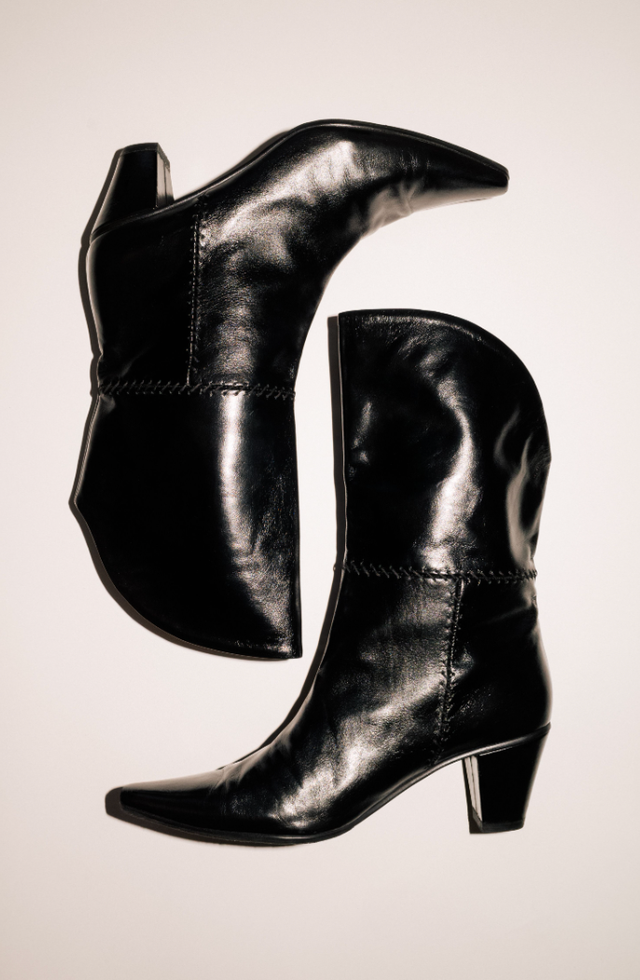 a pair of black leather ankle boots