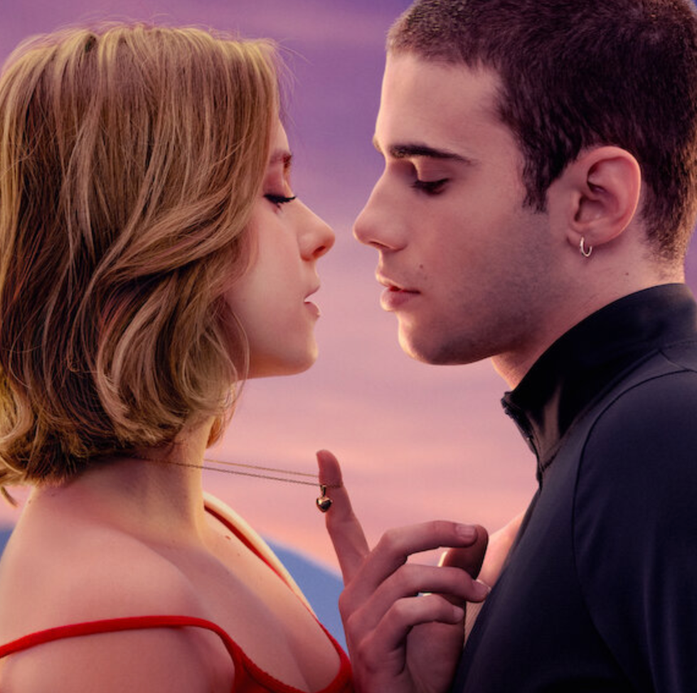 a closeup of two people in an intimate pose against a colorful sunset a closeup of two people in an intimate pose against a colorful sunset