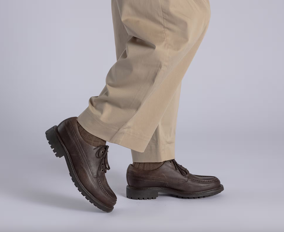 brown shoes with textured soles worn with beige trousers