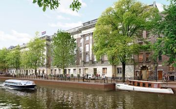 canalside view featuring historic buildings and boats