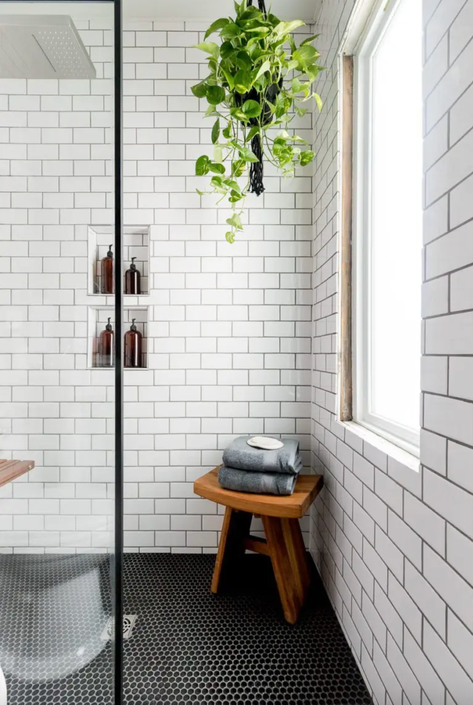 modern bathroom with a shower and natural elements