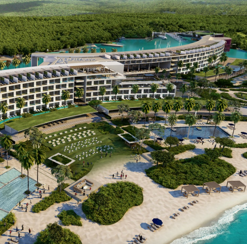 resort complex by the beach with pools and landscaped areas
