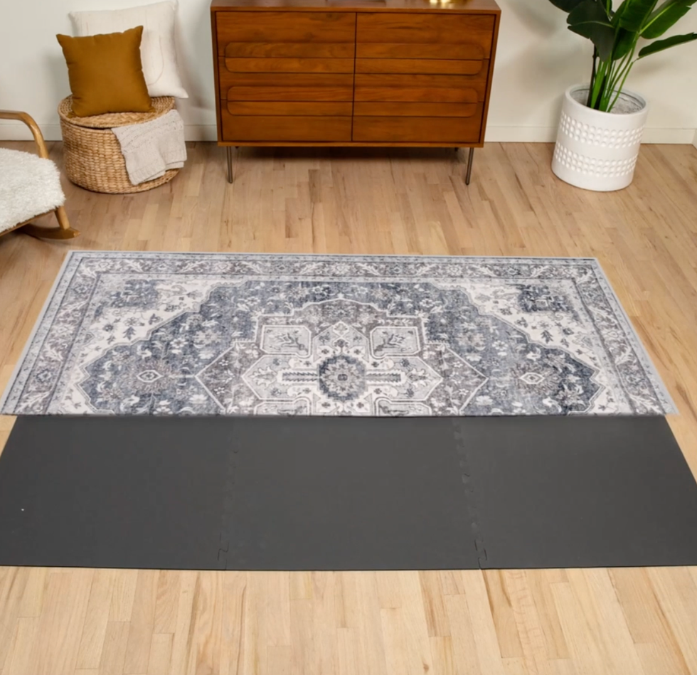tumble rug folded on its grey rug pad