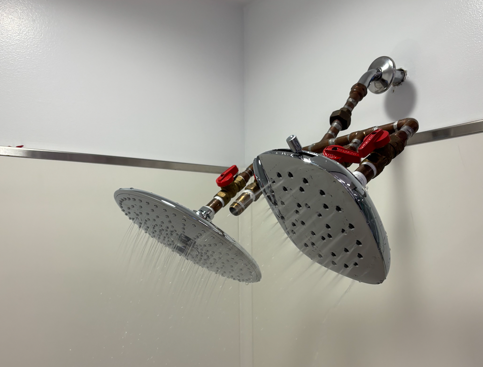 two rain showerheads undergo testing