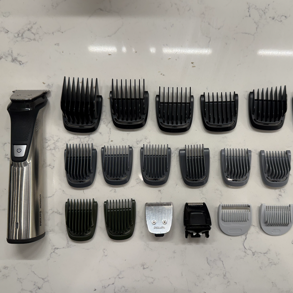 hair clippers with various attachment guards displayed on a countertop