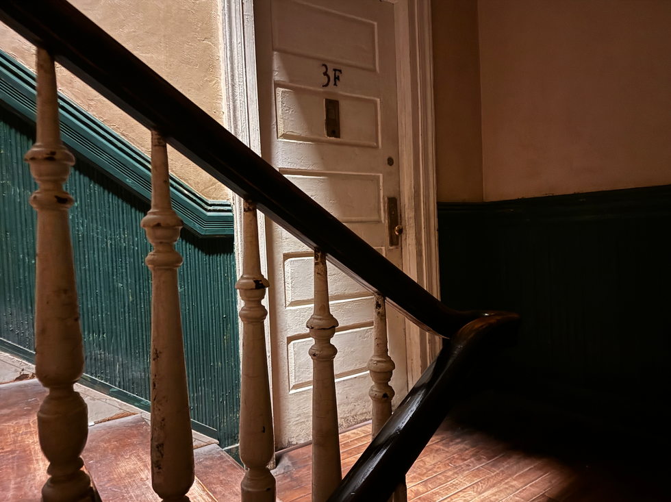 Stairs leading to a door marked 3f in a hallway