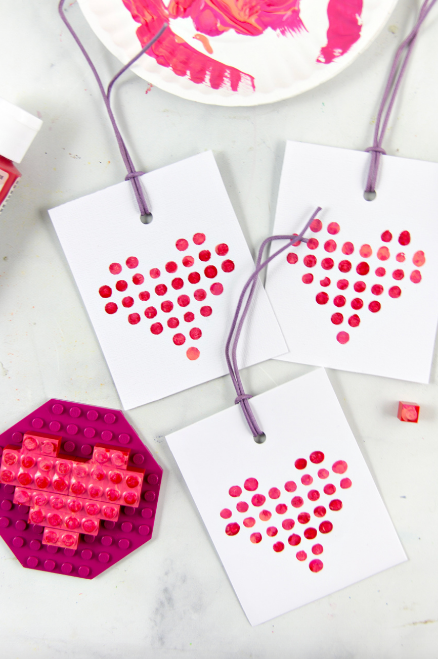 craft materials including heartshaped designs made with paint and building blocks