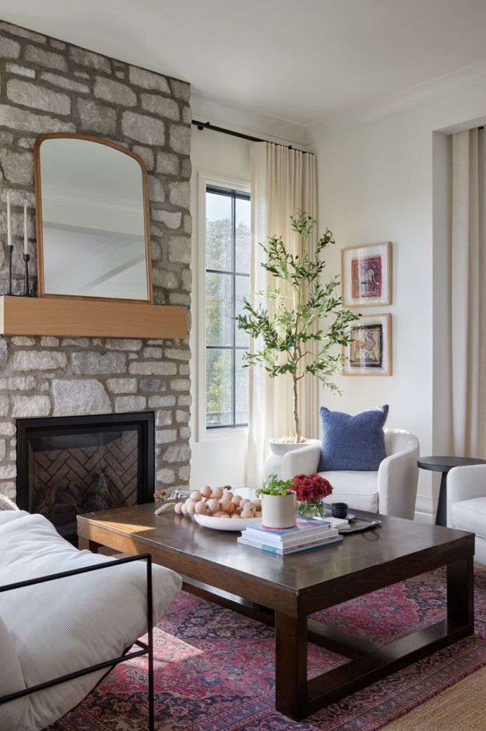 stylish living room featuring a textured wooden coffee table and a dark sofa