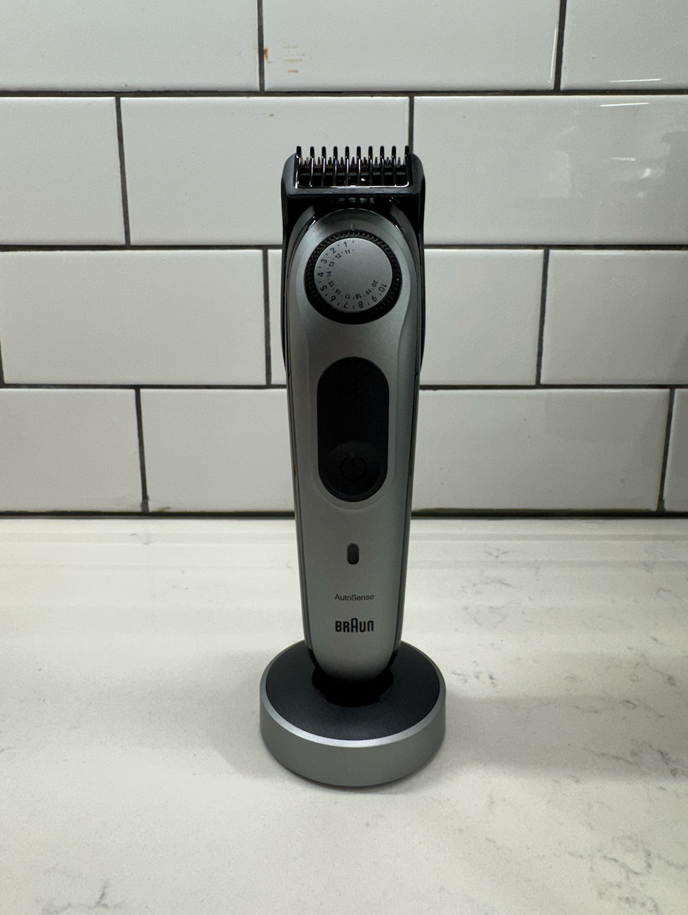 hair clipper with adjustable comb positioned on a counter