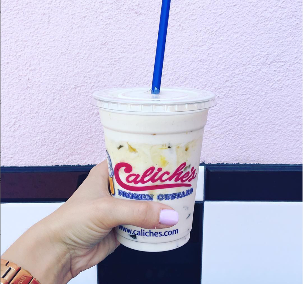 hand holding milkshake