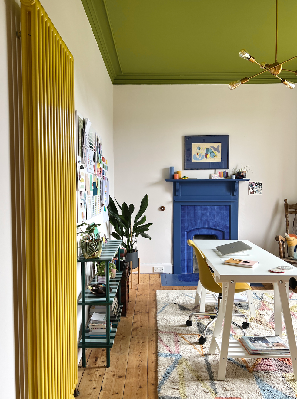 home office with colorful decor desk and plants