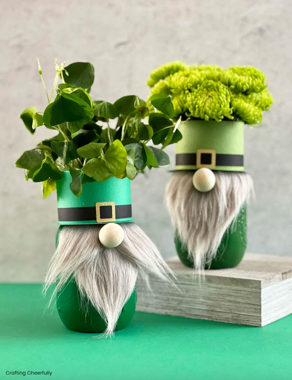 decorative gnome planters with greenery and flowers