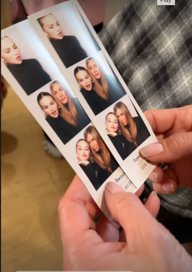 holdings of photo strip with various portraits of herself and jennifer aniston