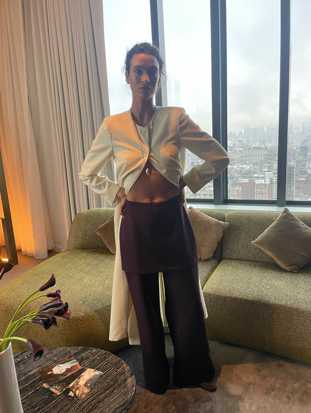 a person wearing stylish clothing in a modern interior space nyfw