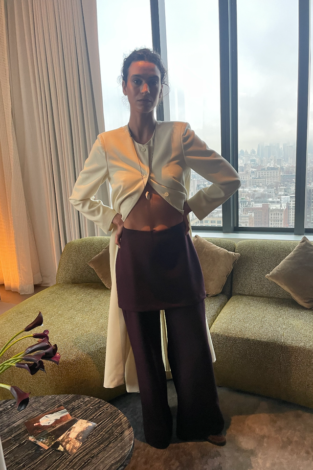 a person wearing stylish clothing in a modern interior space nyfw a person wearing stylish clothing in a modern interior space nyfw