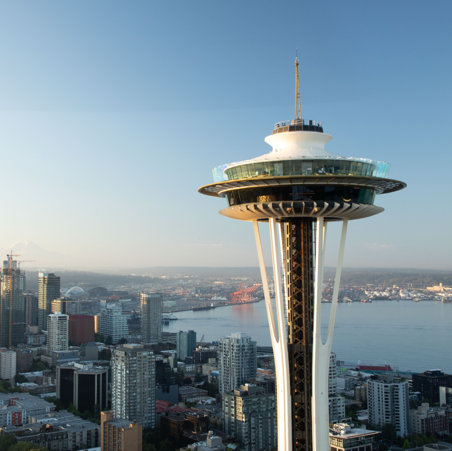 space needle observation tower with urban skyline and water view space needle observation tower with urban skyline and water view
