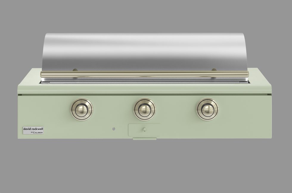 outdoor grill designed by david rockwell featuring three control knobs