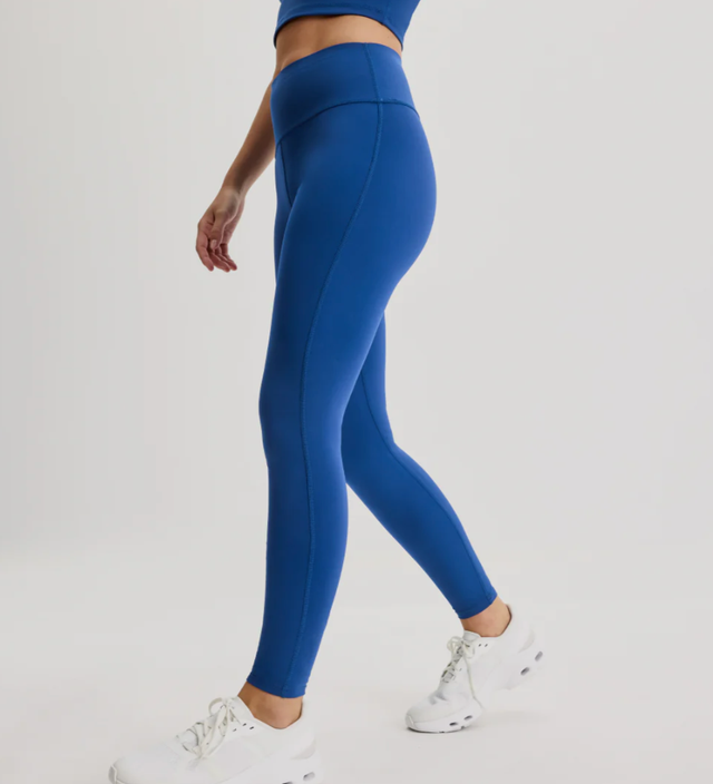 a woman wearing blue period leggings from knixteen