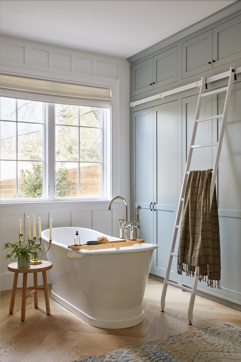 freestanding tub in window with ladder