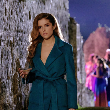 a woman walking with a martini a woman walking with a martini