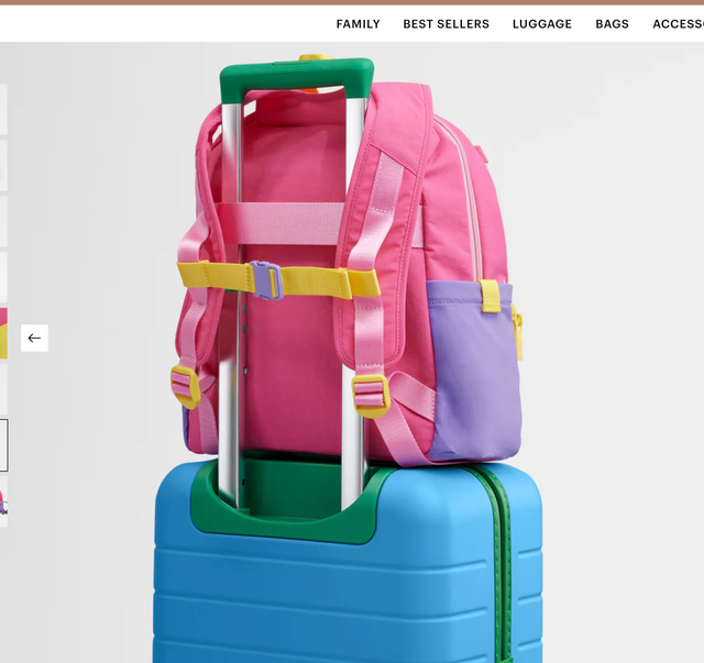 pink child's backpack on top of a blue child's suitcase