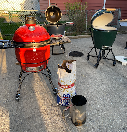 various types of grills and charcoal supplies arranged outdoors