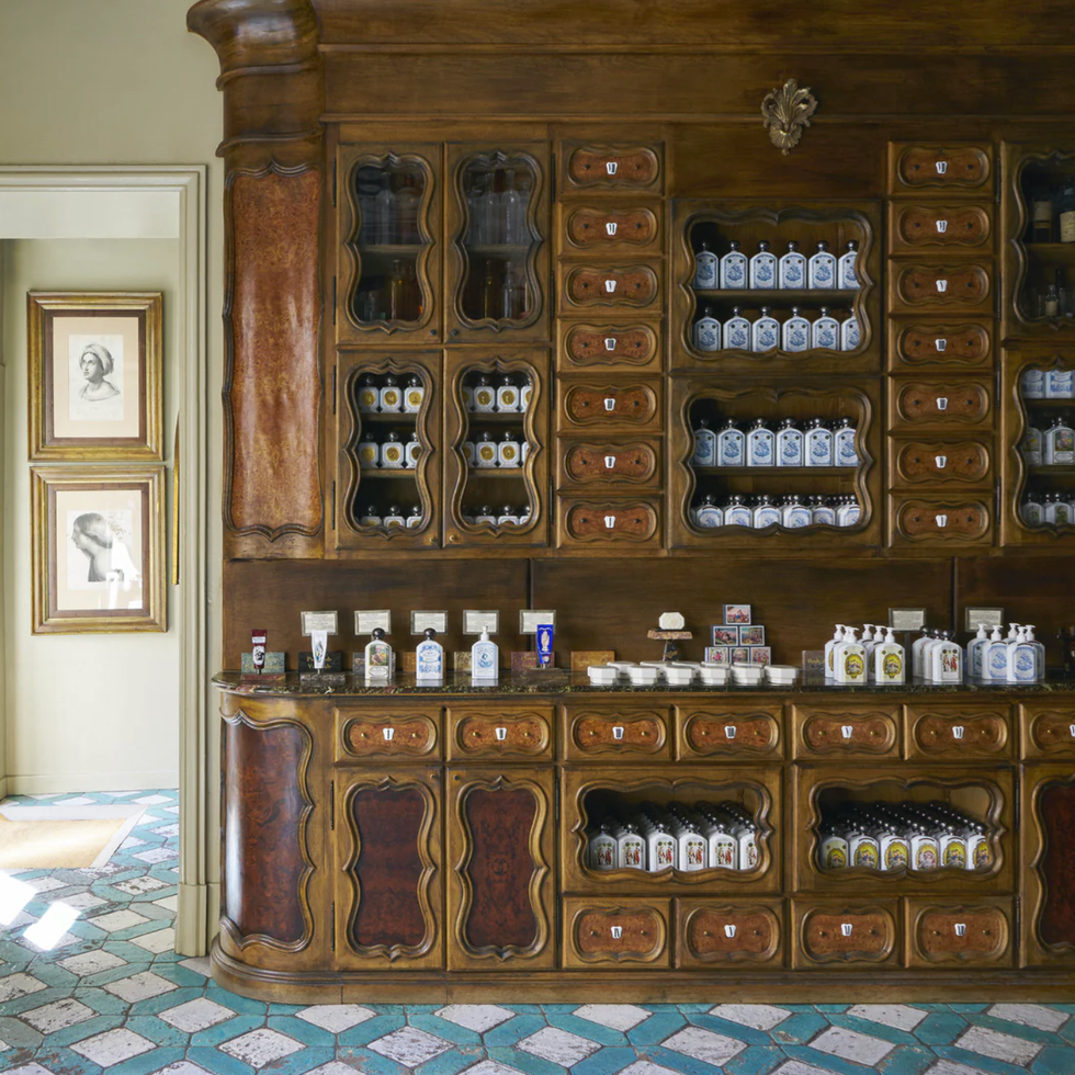 storage cabinet filled with various bottles and jars