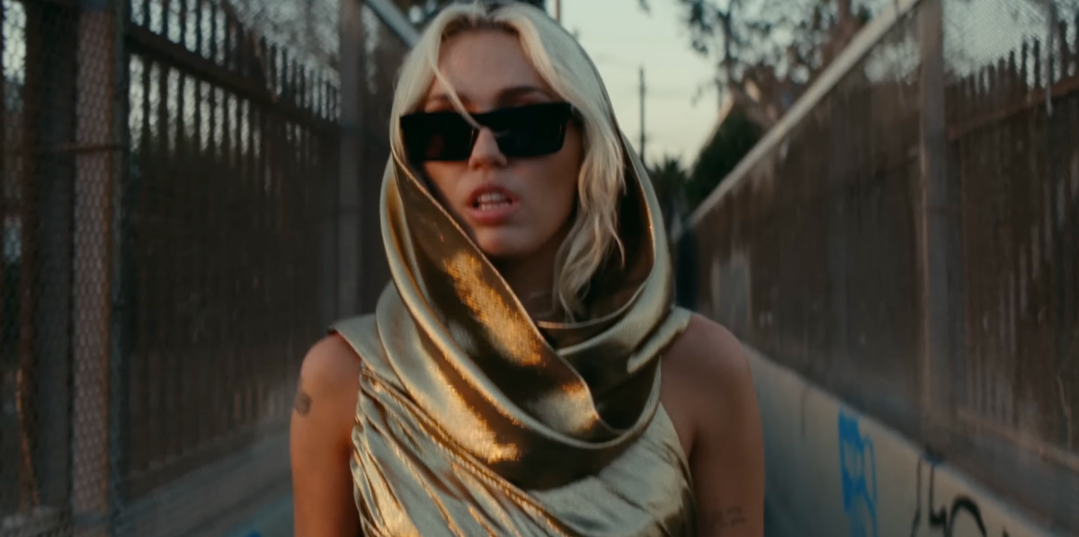 Miley Cyrus Breaks Her Silence on Whether Her Gold “Flowers” Dress Is Tied to Jennifer Lawrence