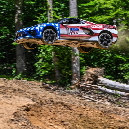 Watch a C8 Corvette Fly More Than 100 Feet Through the Air at Travis Pastrana's Dirt Playground