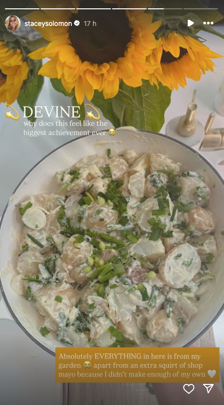 bowl of creamy potato salad with fresh herbs and ingredients