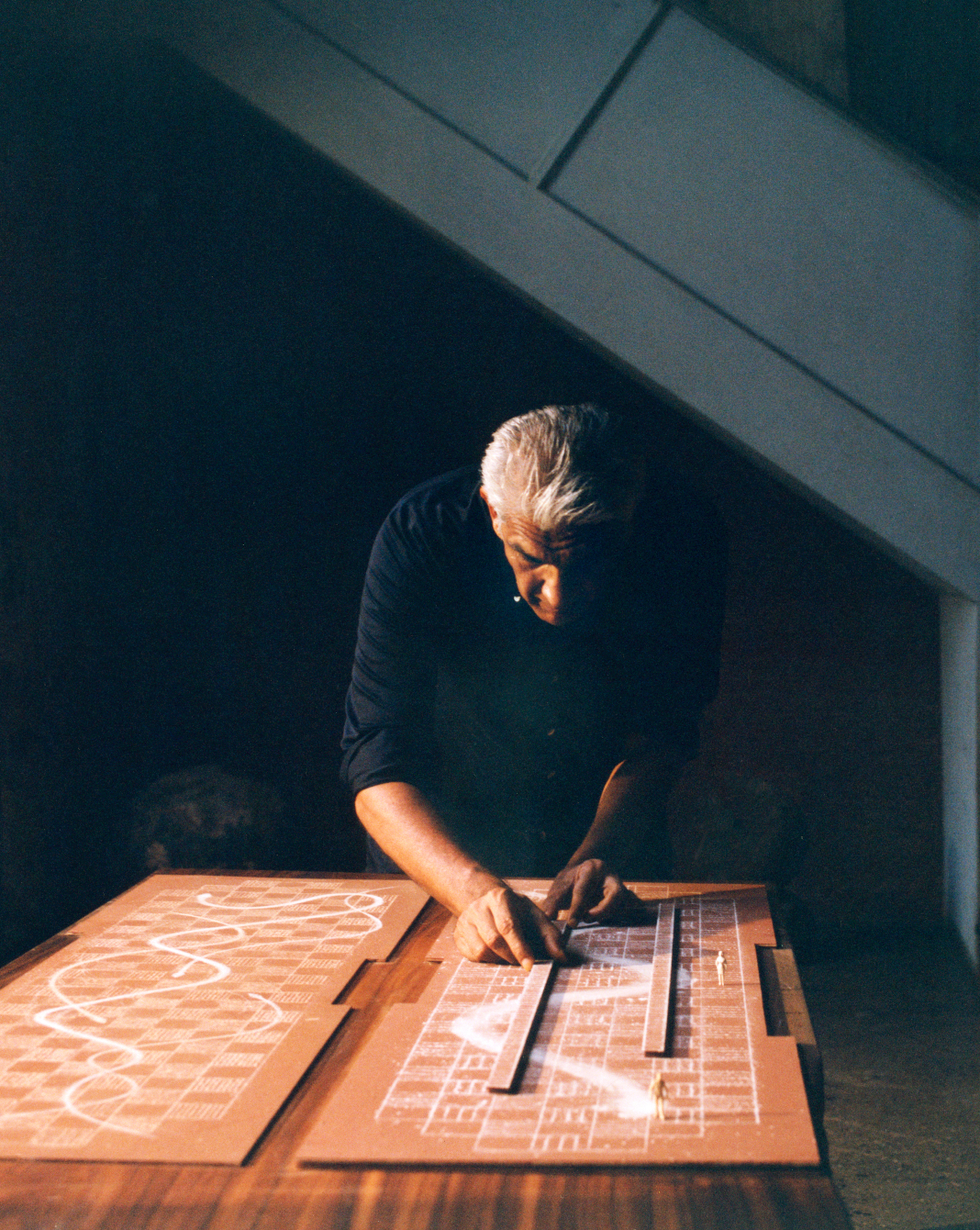 man working on a design layout