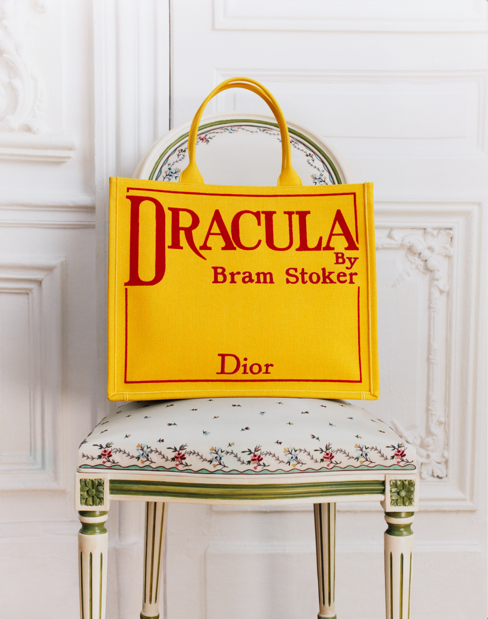 yellow tote bag featuring dracula by bram stoker and dior text