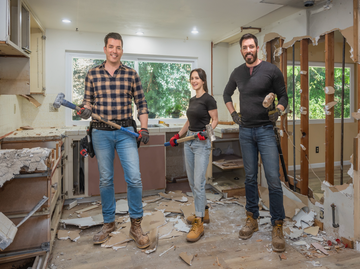 three individuals in a construction zone with tools for demolition