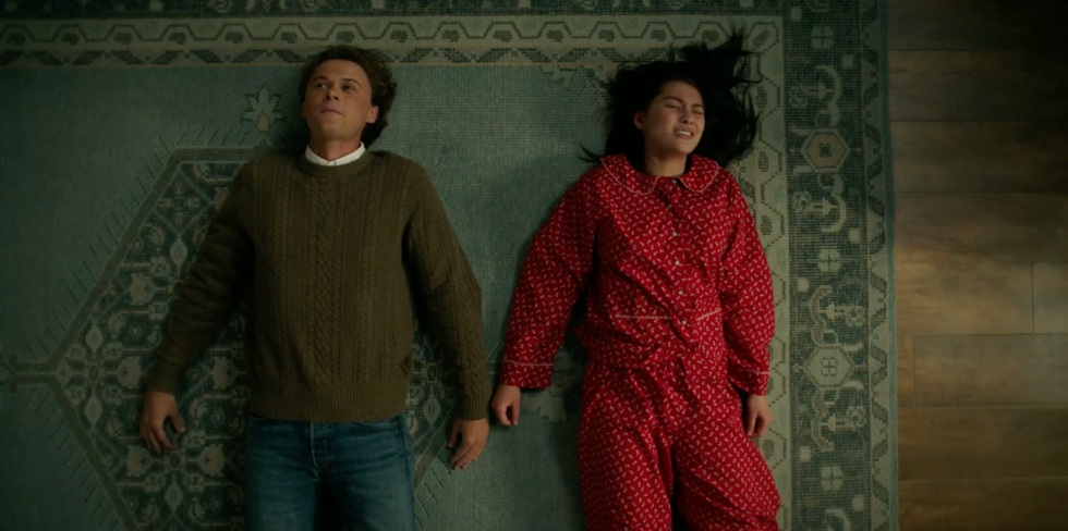 conrad and belly laying on the carpet
