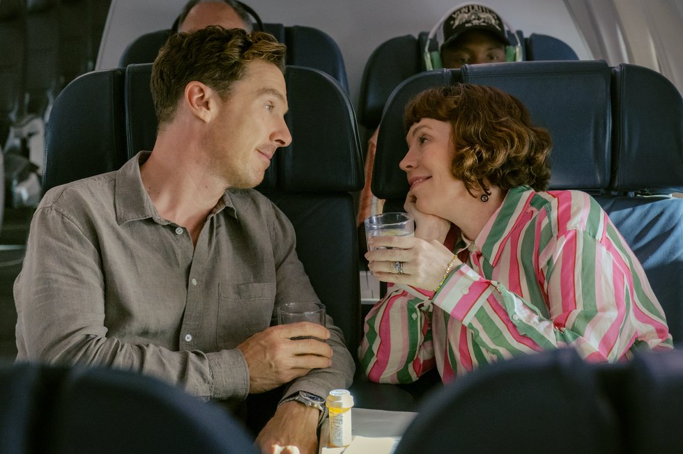 passengers enjoying drinks in an airplane cabin