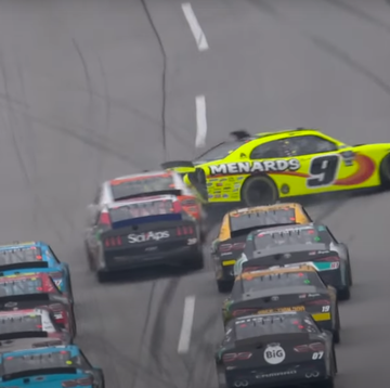 a group of race cars on a road