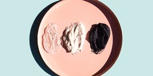 scrub or beauty facial masks smears on pastel pink plate